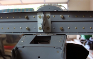 Another view of the four bolts holding the horizontal stabilizer to the F-711C vertical bars.